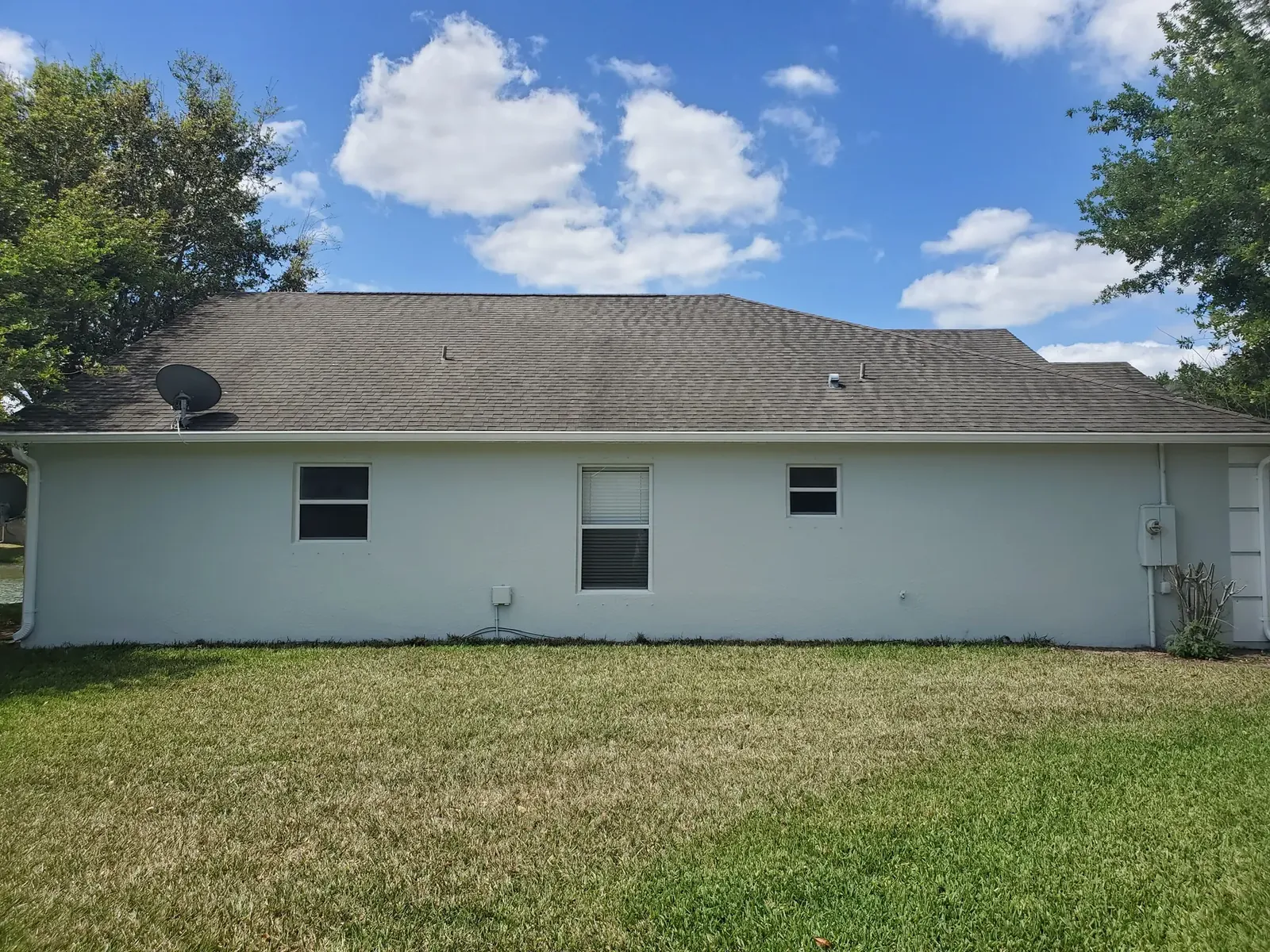 Clean white exterior finish - real Volusia County painting project