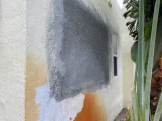 Stucco patch before finish paint - real Volusia County painting project