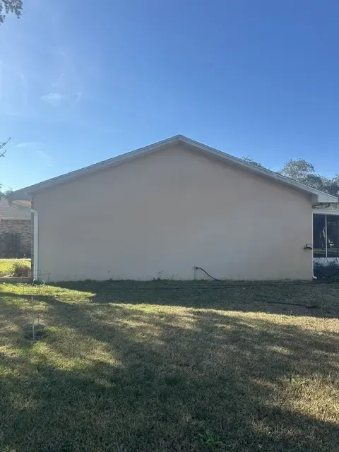 Oak Hill stucco before painting - real Volusia County painting project