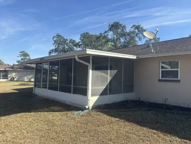 Oak Hill stucco before painting - real Volusia County painting project