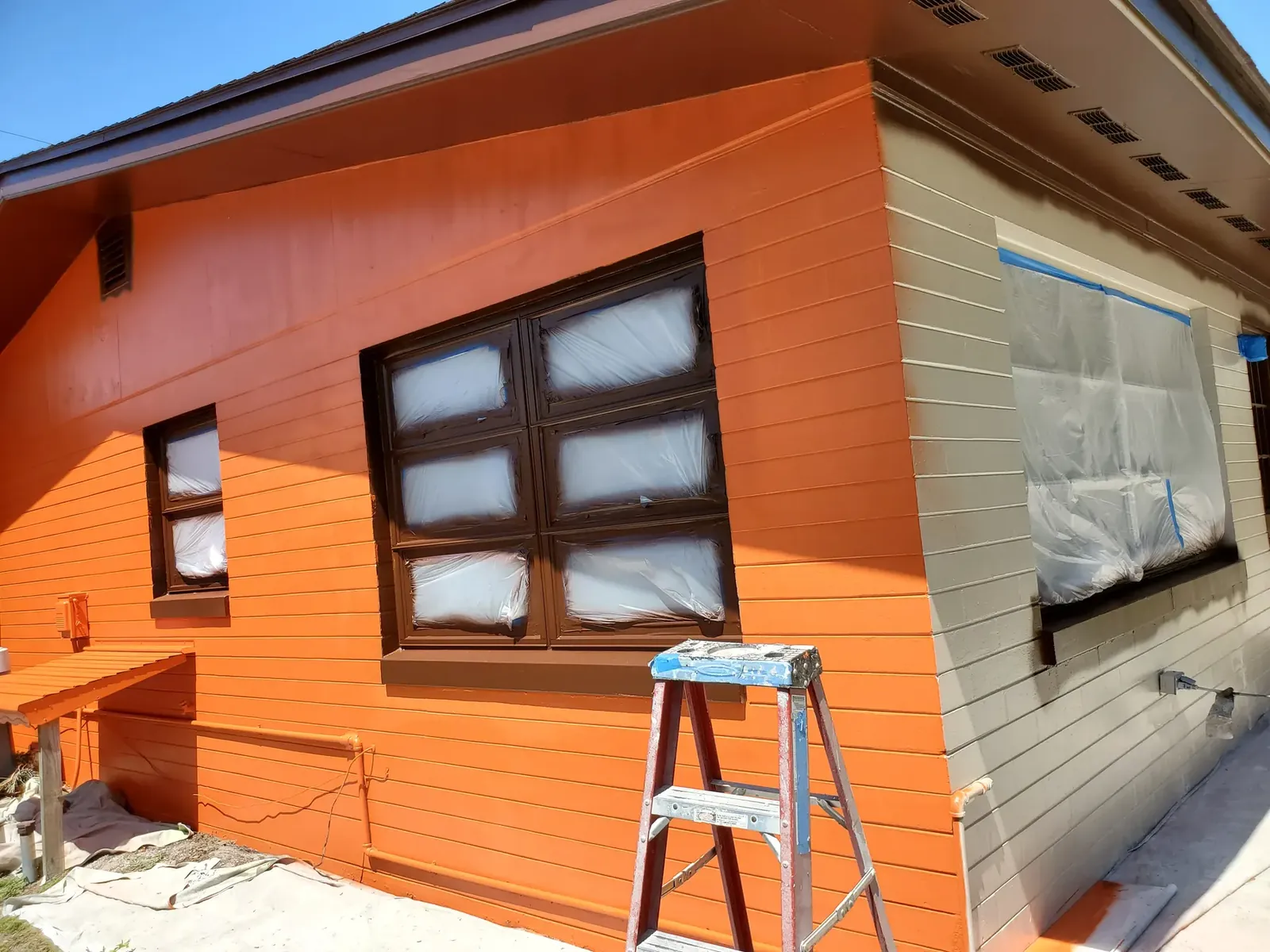 Warm orange exterior after painting - real Volusia County painting project