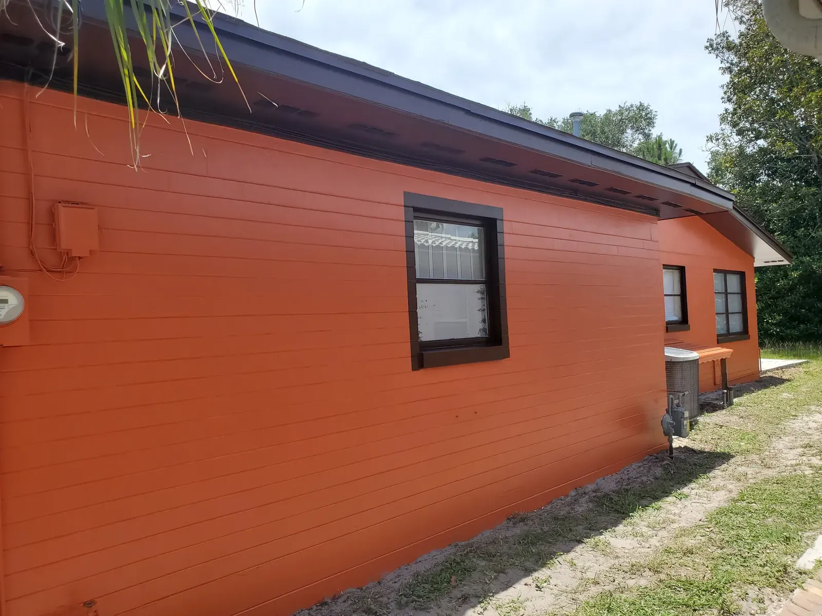 Warm orange exterior after painting - real Volusia County painting project