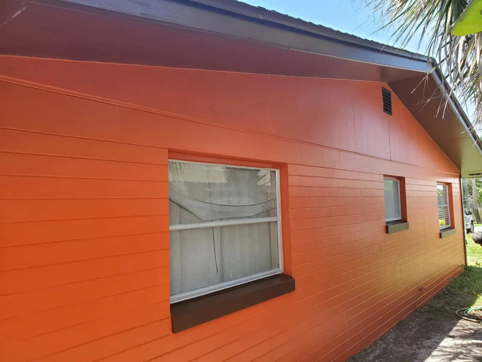 Warm orange exterior after painting - real Volusia County painting project