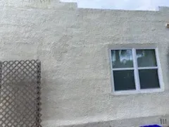 Stucco repair and prep detail - real Volusia County painting project