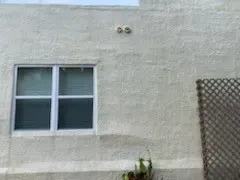 Stucco repair and prep detail - real Volusia County painting project