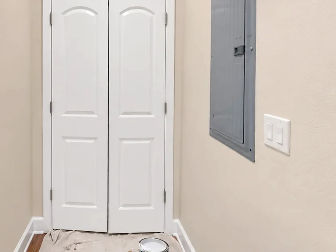 Clean trim and door work inside a freshly painted room