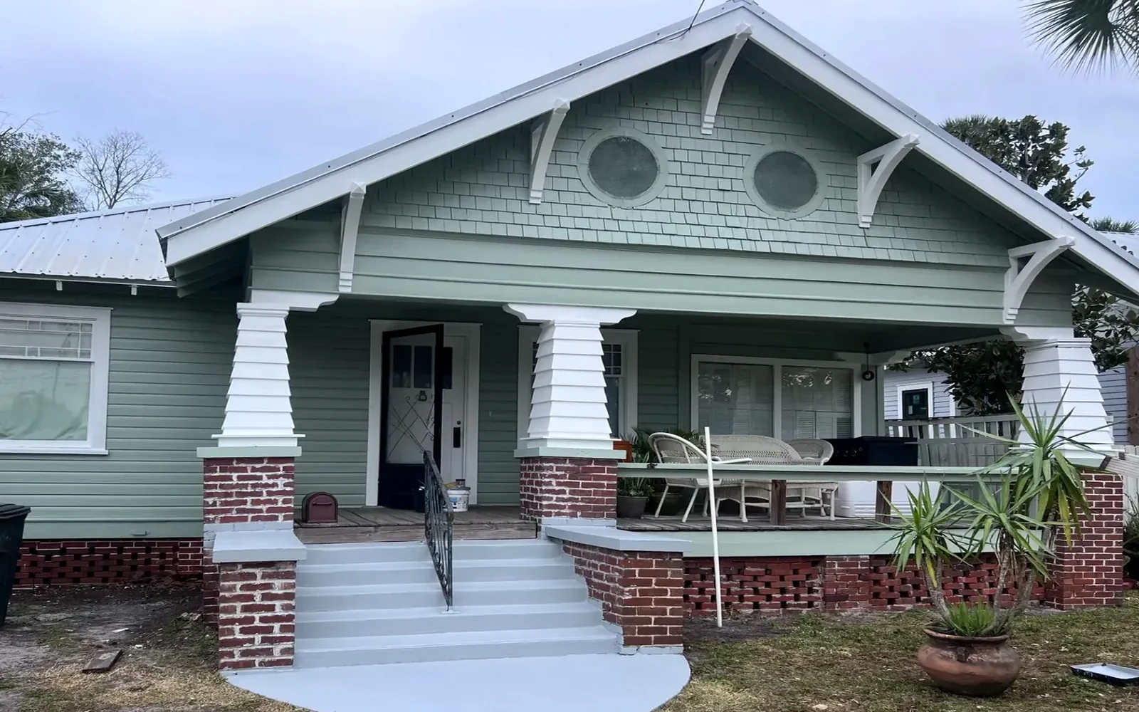Real New Smyrna Beach home after a green and white exterior repaint
